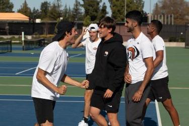 Men's tennis celebrates win over San Diego